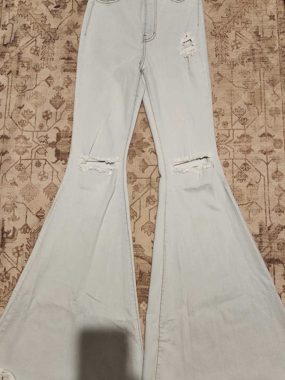 Vibrant Light Blue High-Rise Flare Jeans with Knee Rips